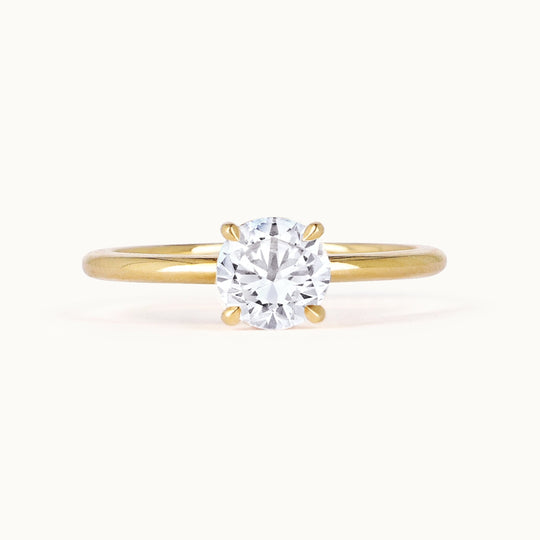 Primrose Ring in 18K recycled yellow gold, featuring a brilliant-cut lab-grown diamond solitaire. Handcrafted in Antwerp, the perfect engagement ring.