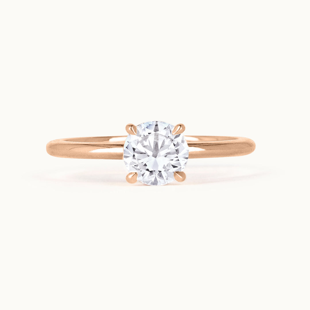 Primrose Ring in 18K recycled rose gold, showcasing a brilliant-cut lab-grown diamond solitaire. A timeless engagement ring, sustainably crafted in Antwerp.