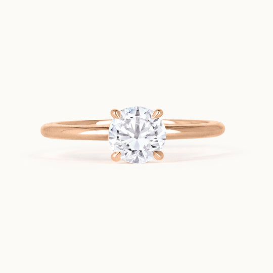 Primrose Ring in 18K recycled rose gold, showcasing a brilliant-cut lab-grown diamond solitaire. A timeless engagement ring, sustainably crafted in Antwerp.