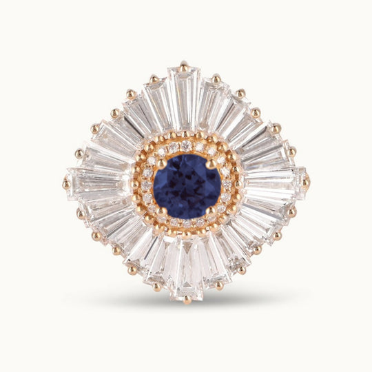 Ballerina Dusk Ring in recycled 18K yellow gold with a blue sapphire in a ballerina setting of tapered baguette diamonds