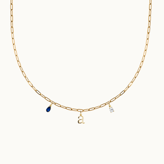 18 carat gold paperclip chain necklace featuring dangling gemstone charms, birthstone charm necklace and an initial or letter charm with labgrown diamonds on a chunky chain