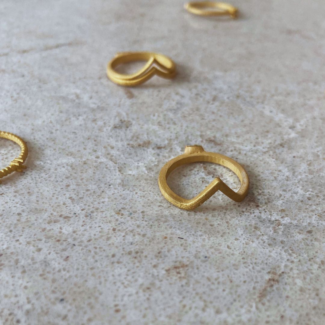 Recycled 18k gold refined from electronic waste and jewelry, highlighting sustainable luxury and eco-conscious jewelry design.