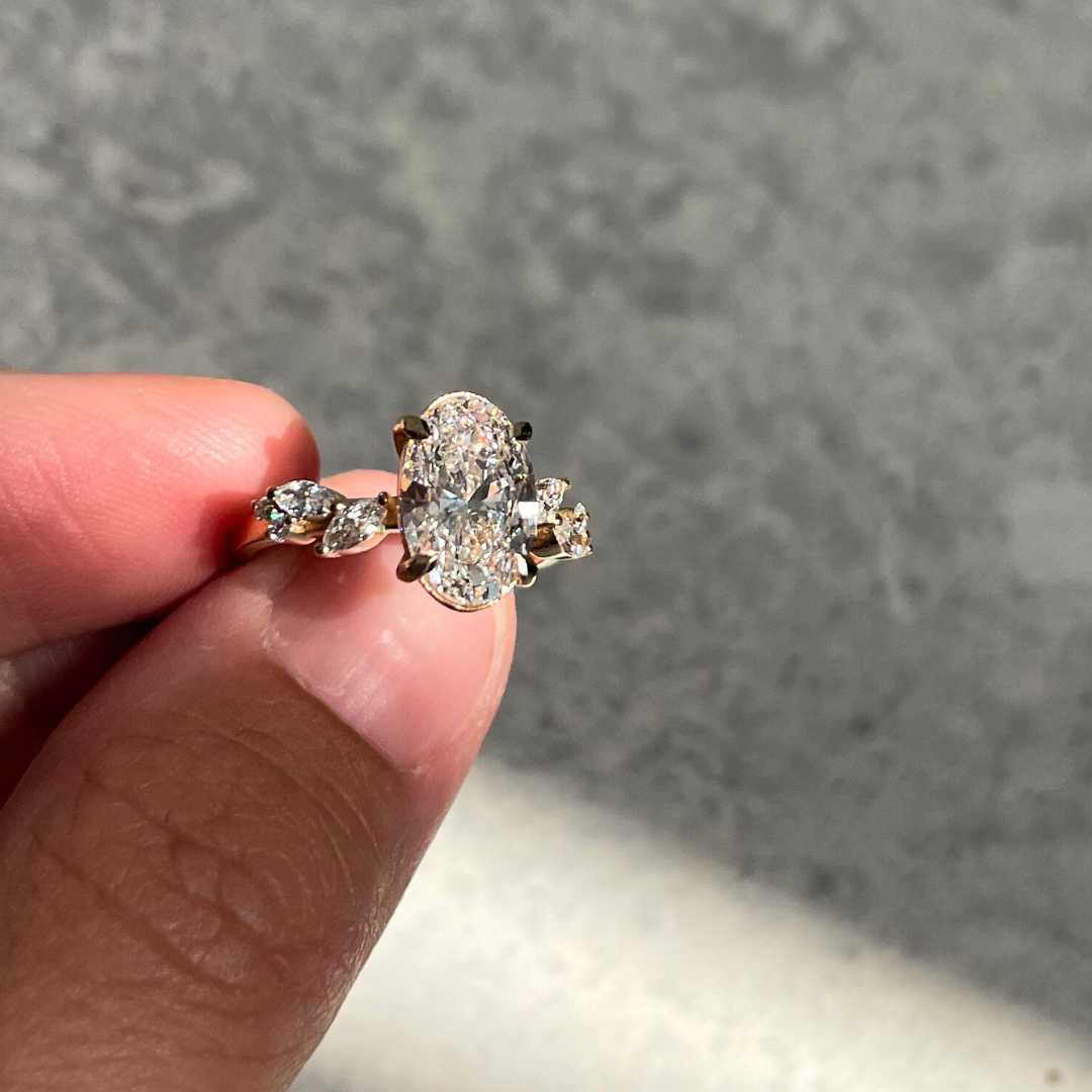 Whimsical oval lab-grown diamonds engagement ring that was custom designed and handmade in Antwerp by Juna Fae