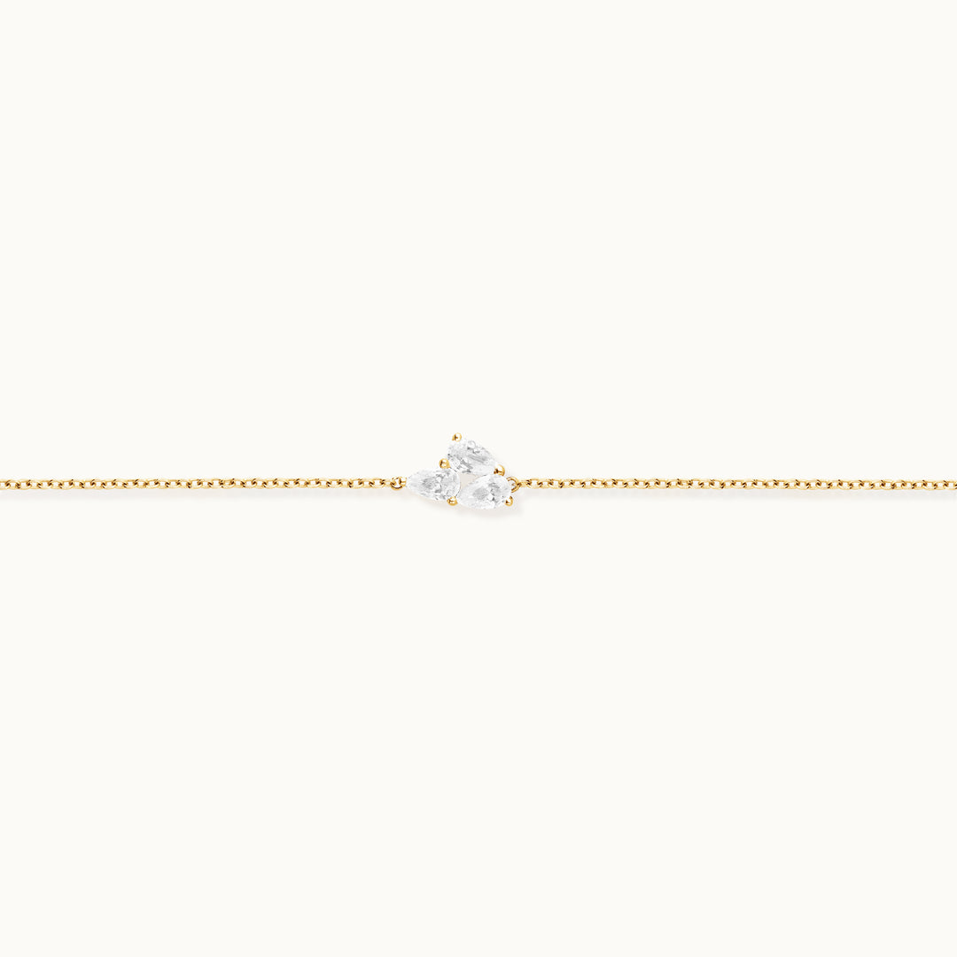 Bloom Bracelet in recycled 18K yellow gold with 3 lab-grown pear diamonds.