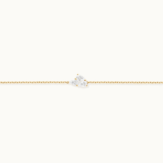 Bloom Bracelet in recycled 18K yellow gold with 3 lab-grown pear diamonds.