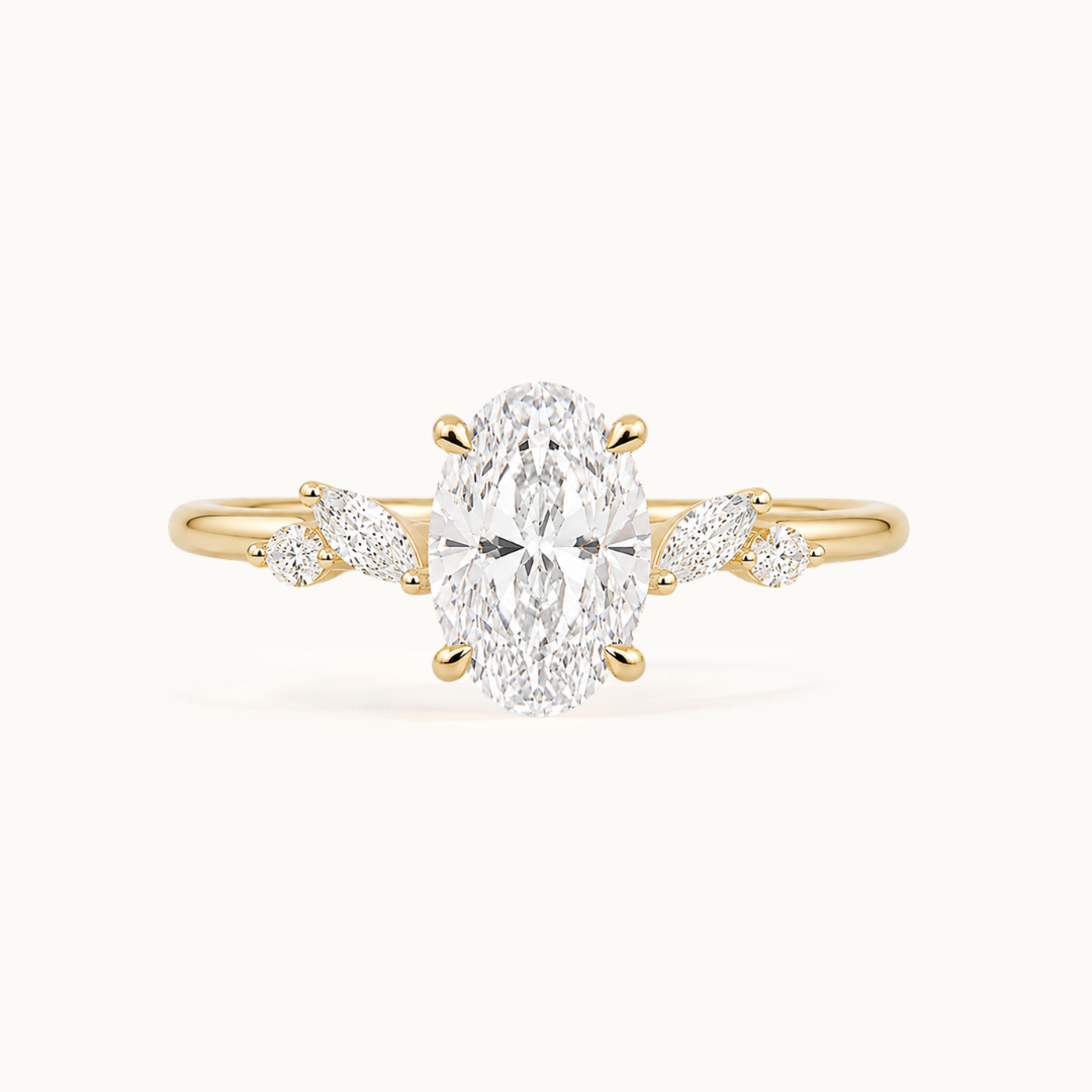 Vintage inspired floral engagement ring in recycled 18K yellow gold with oval and marquise-shaped lab-grown diamonds
