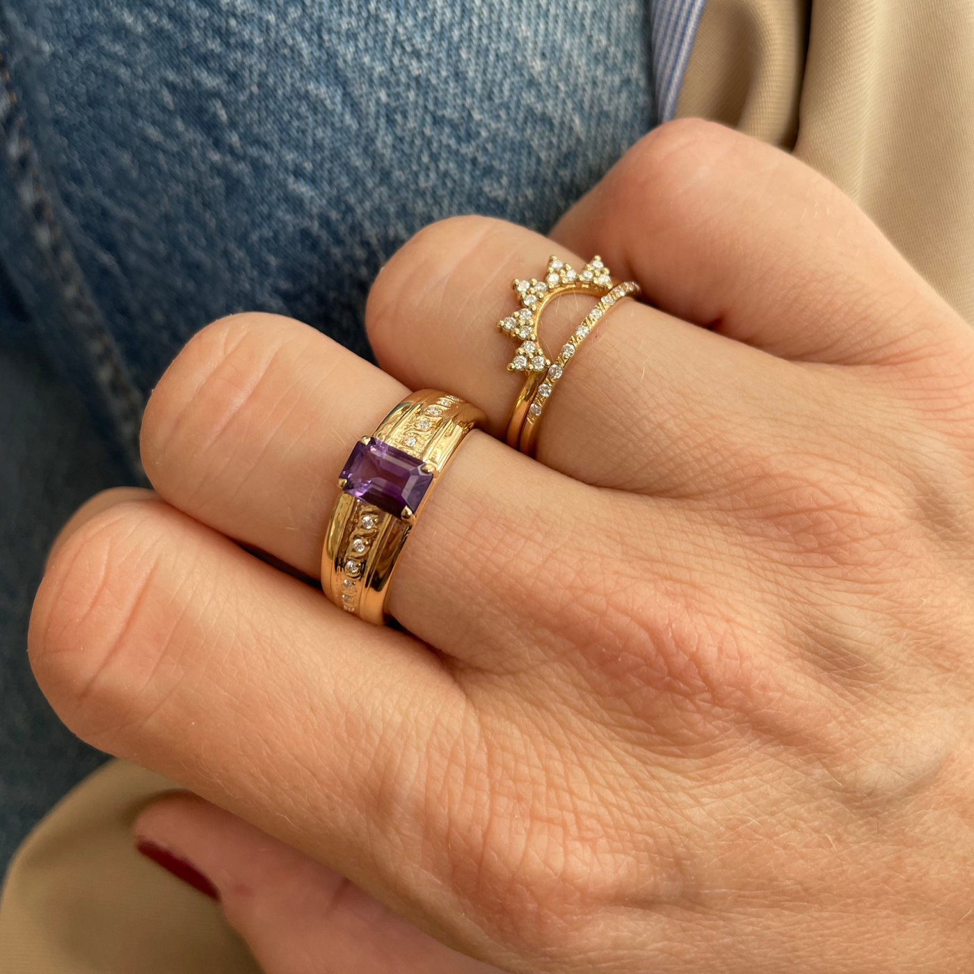 Daisy Ring and Marigold Ring stacked on the hand with the Majestic Mauve Ring