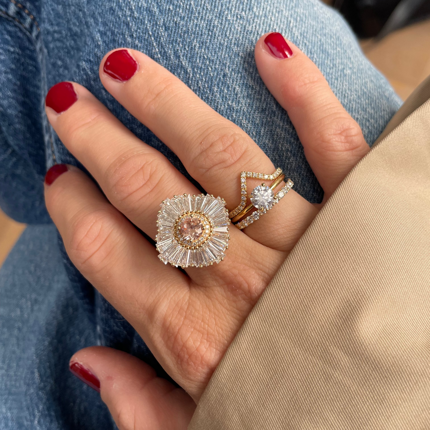 Ballerina Blush Ring stacked with a V-shaped diamond ring on the hand