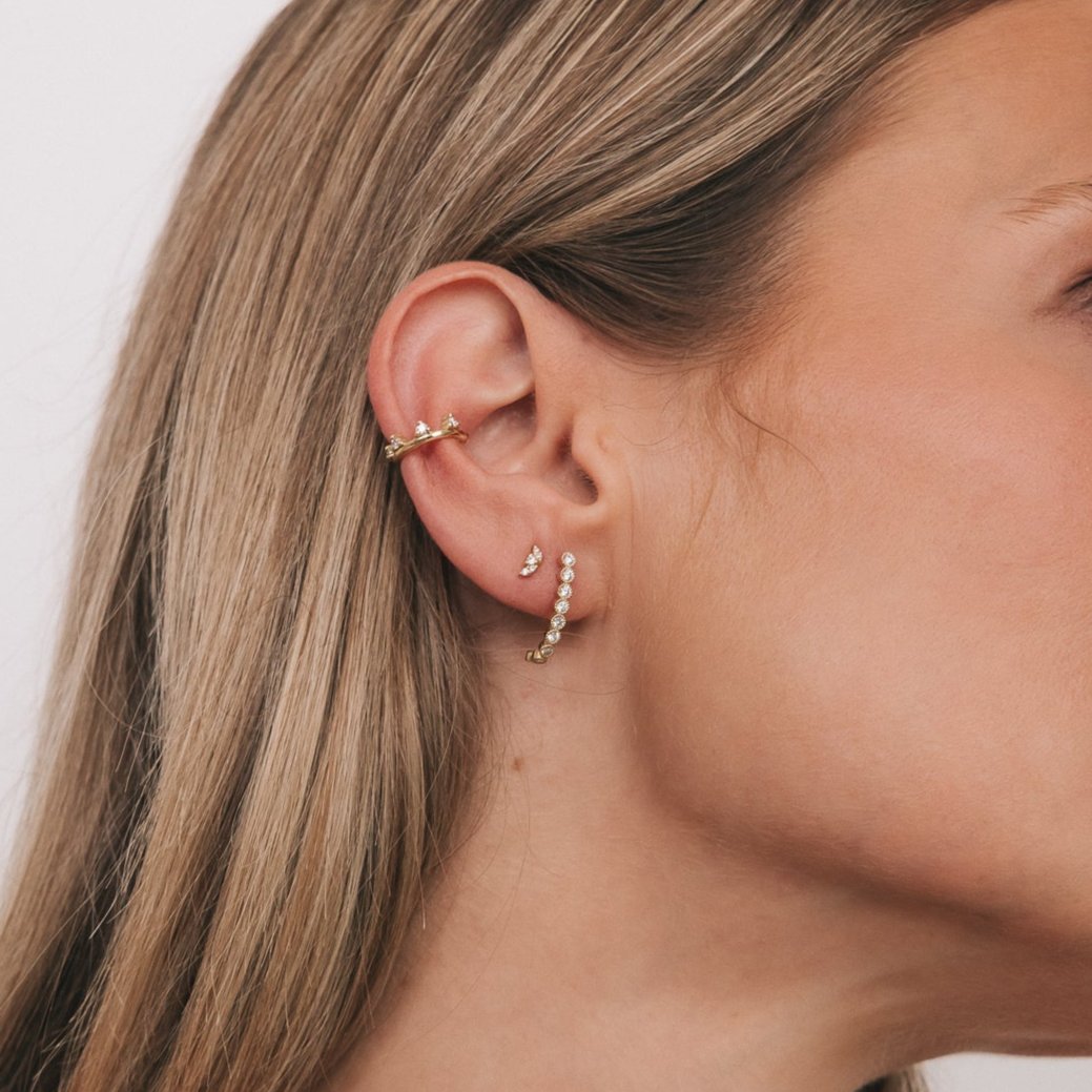 Model wearing the Lavender Stud in an ear stack with a hoop