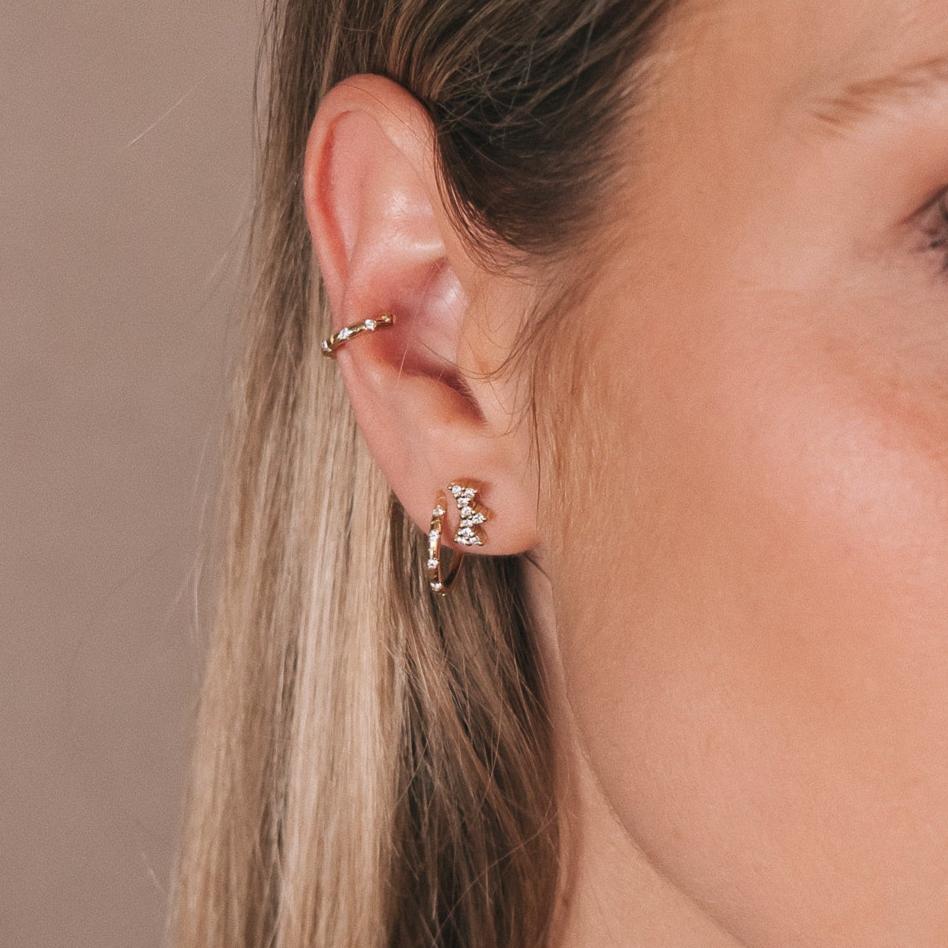 Model wearing the Marigold Stud in an ear stack