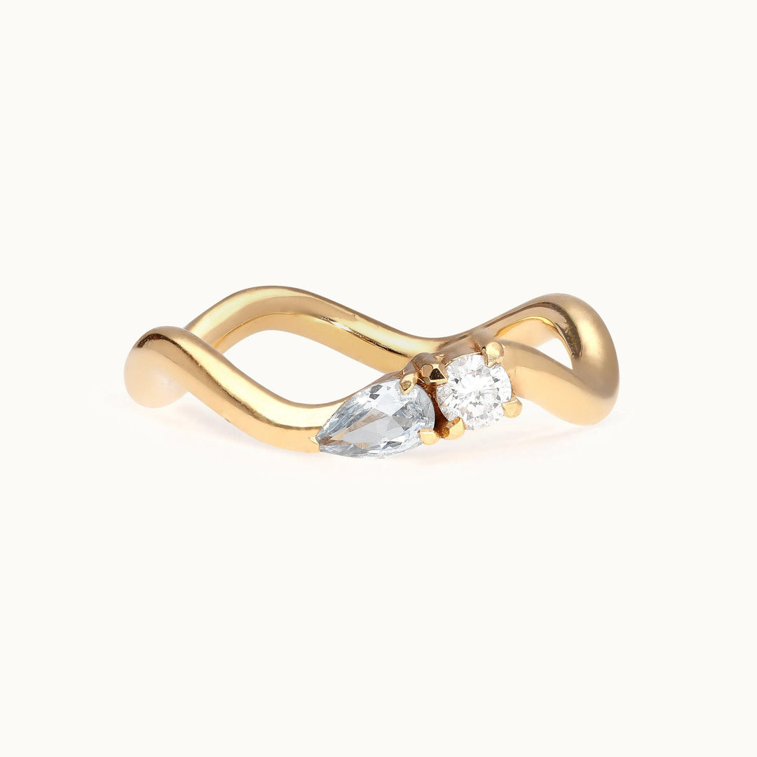 Seaside Serenade diamond and aquamarine wave engagement ring in recycled 18K gold