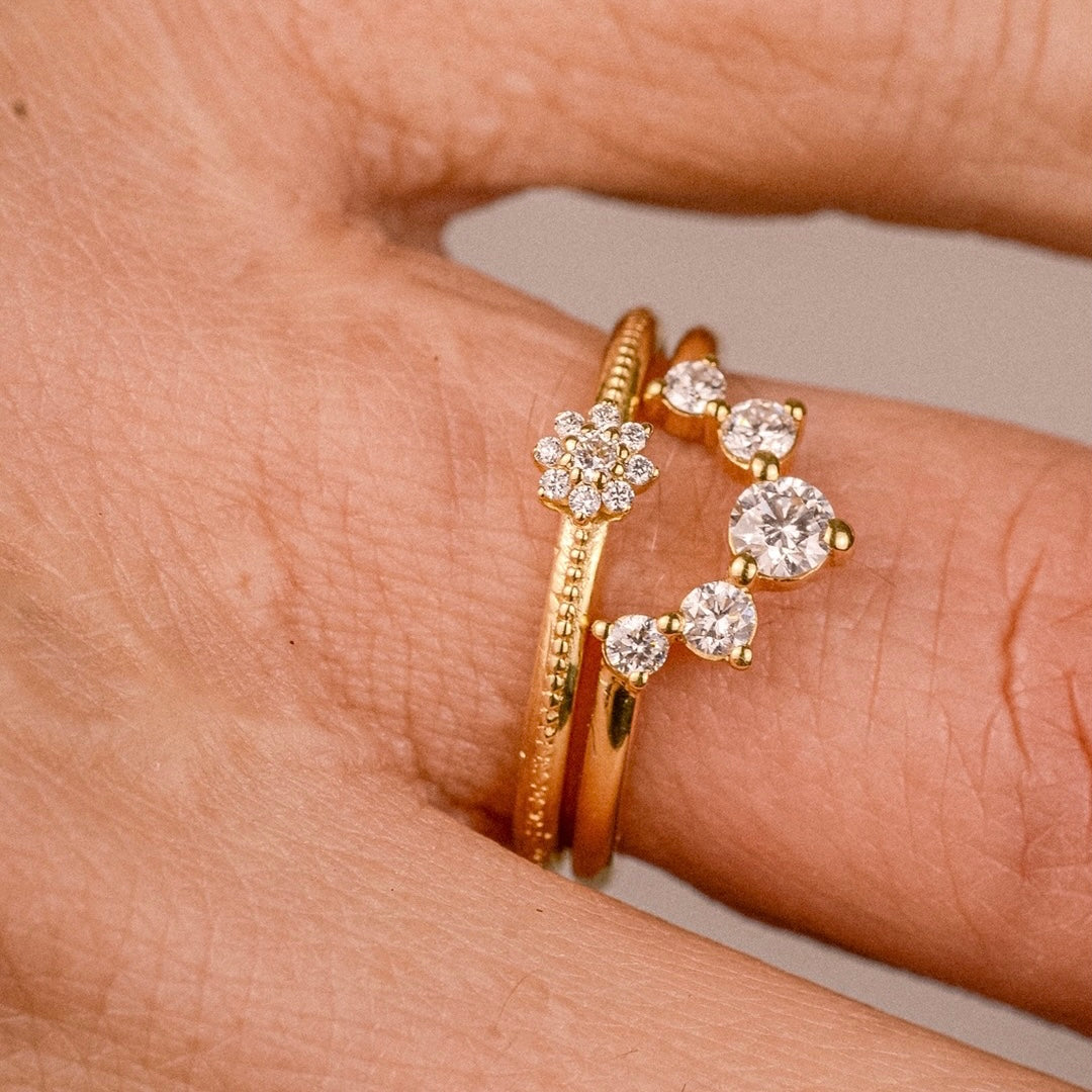 Flora Ring close-up worn in a stack – 18k gold floral ring with lab-grown diamonds