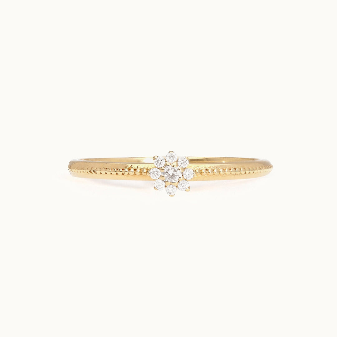Floral cluster diamond engagement ring in recycled 18K gold with a blooming silhouette