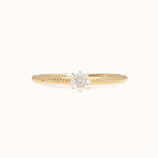 Floral cluster diamond engagement ring in recycled 18K gold with a blooming silhouette