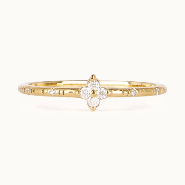 Clover-inspired ring with lab-grown diamonds set in recycled 18K gold.