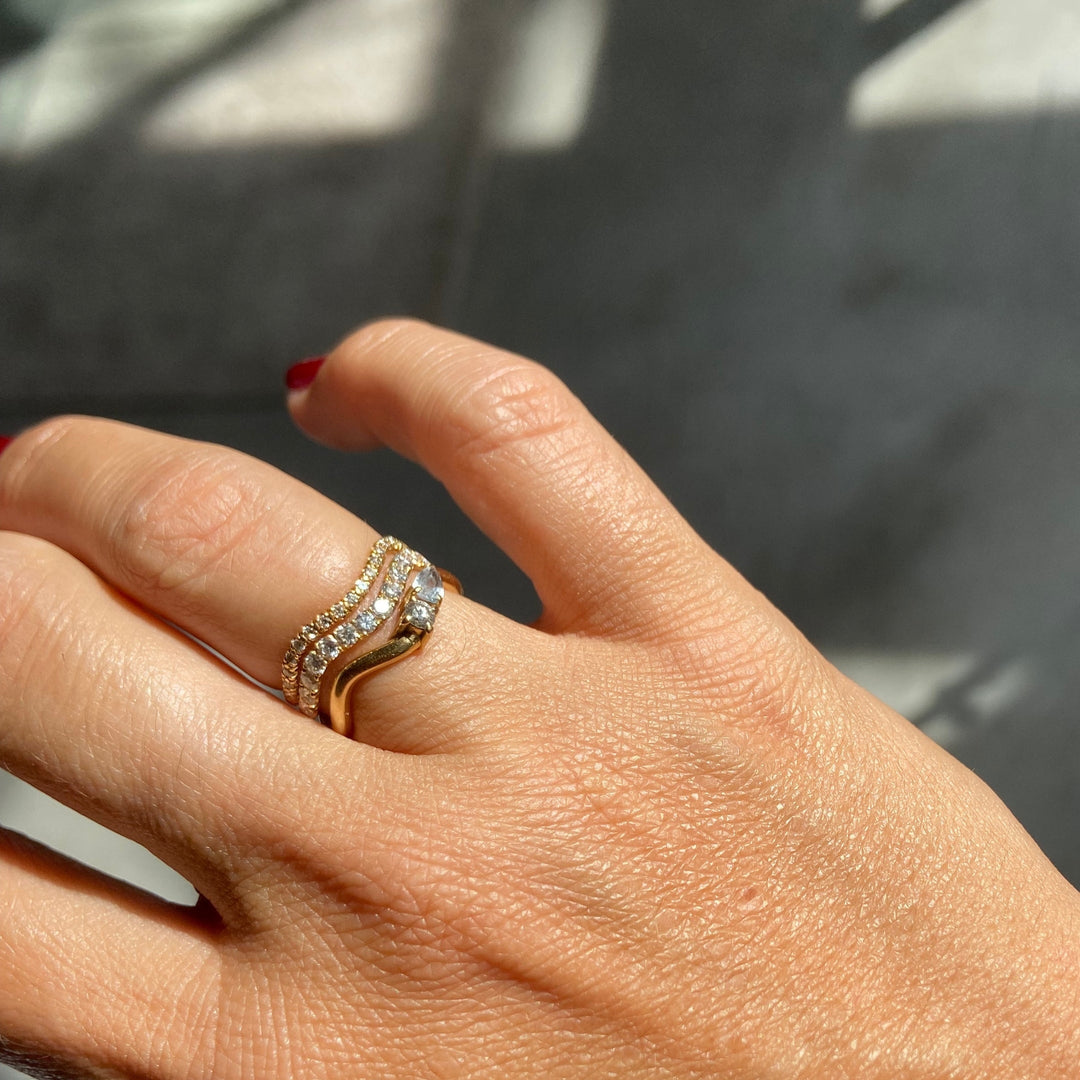 Cordelia Grand Ring stacked with diamond wave rings on the hand, recycled 18K yellow gold