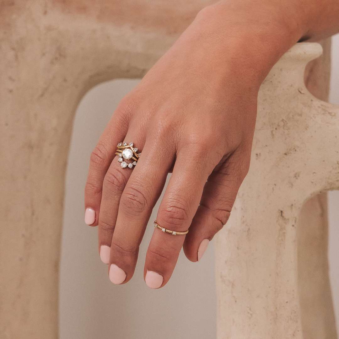 Stackable Primrose Ring in 18K recycled yellow gold, featuring a brilliant-cut lab-grown diamond solitaire. Handcrafted in Antwerp, the perfect engagement ring to pair with a wedding ring.