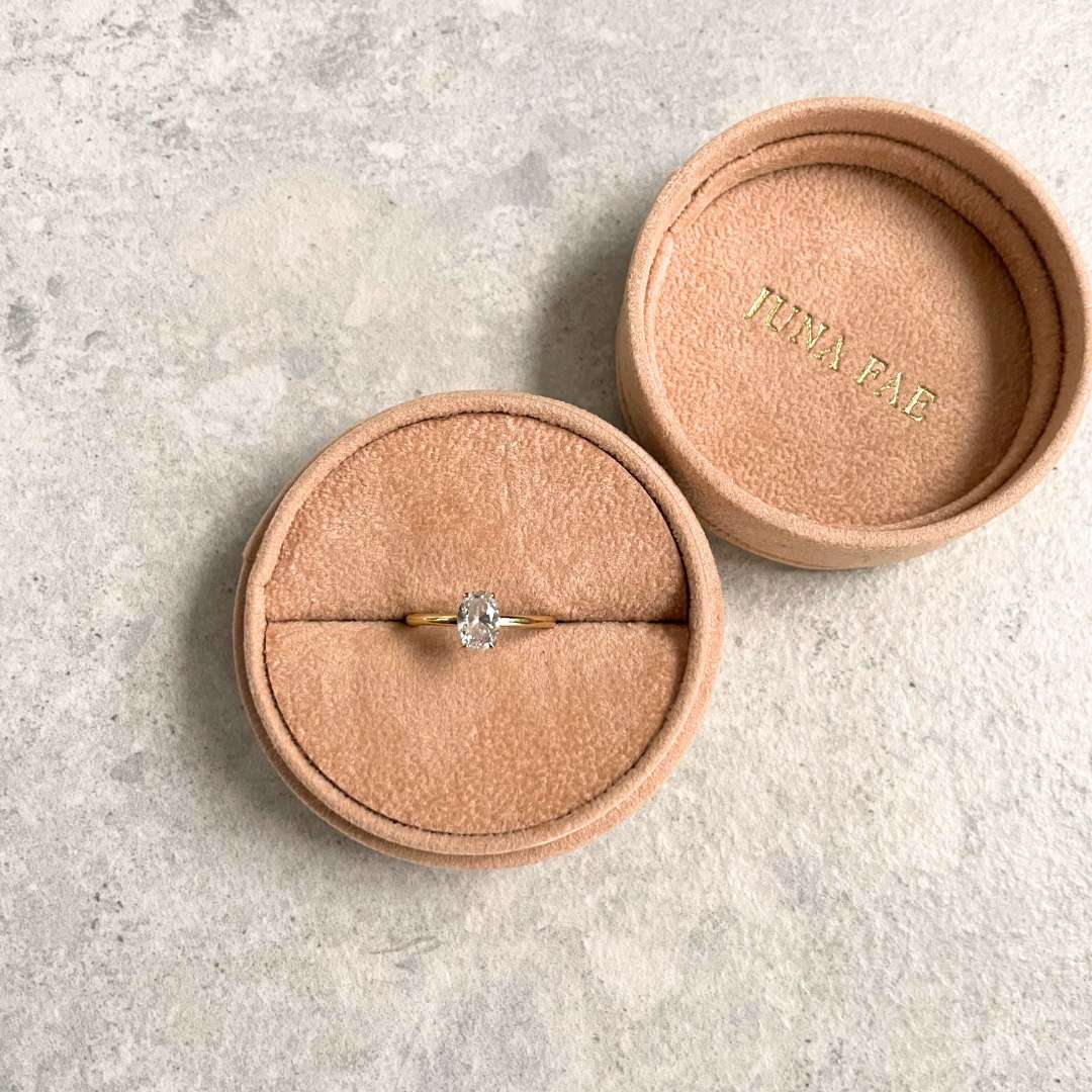 Timeless and classic solitaire engagement ring handcrafted from 18k recycled gold, featuring a oval lab-grown diamond by Juna Fae based in Antwerp.