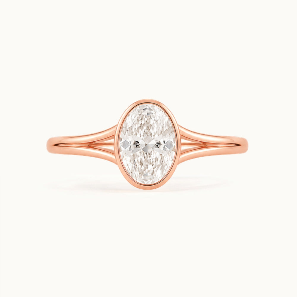 Aveline Ring, an oval lab-grown diamond in a bezel on a split shank, recycled 18K rose gold