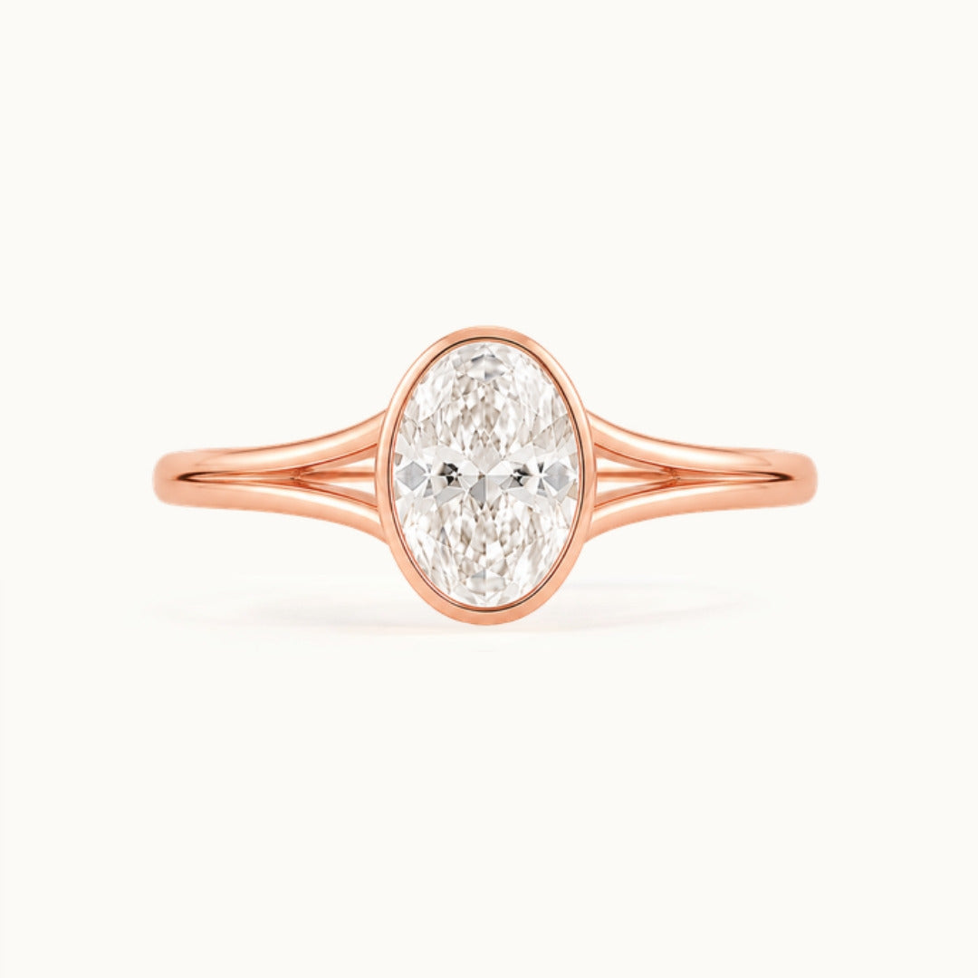 Aveline Ring, an oval lab-grown diamond in a bezel on a split shank, recycled 18K rose gold