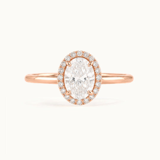 Dahlia Ring, an oval lab-grown diamond in a diamond halo, recycled 18K rose gold