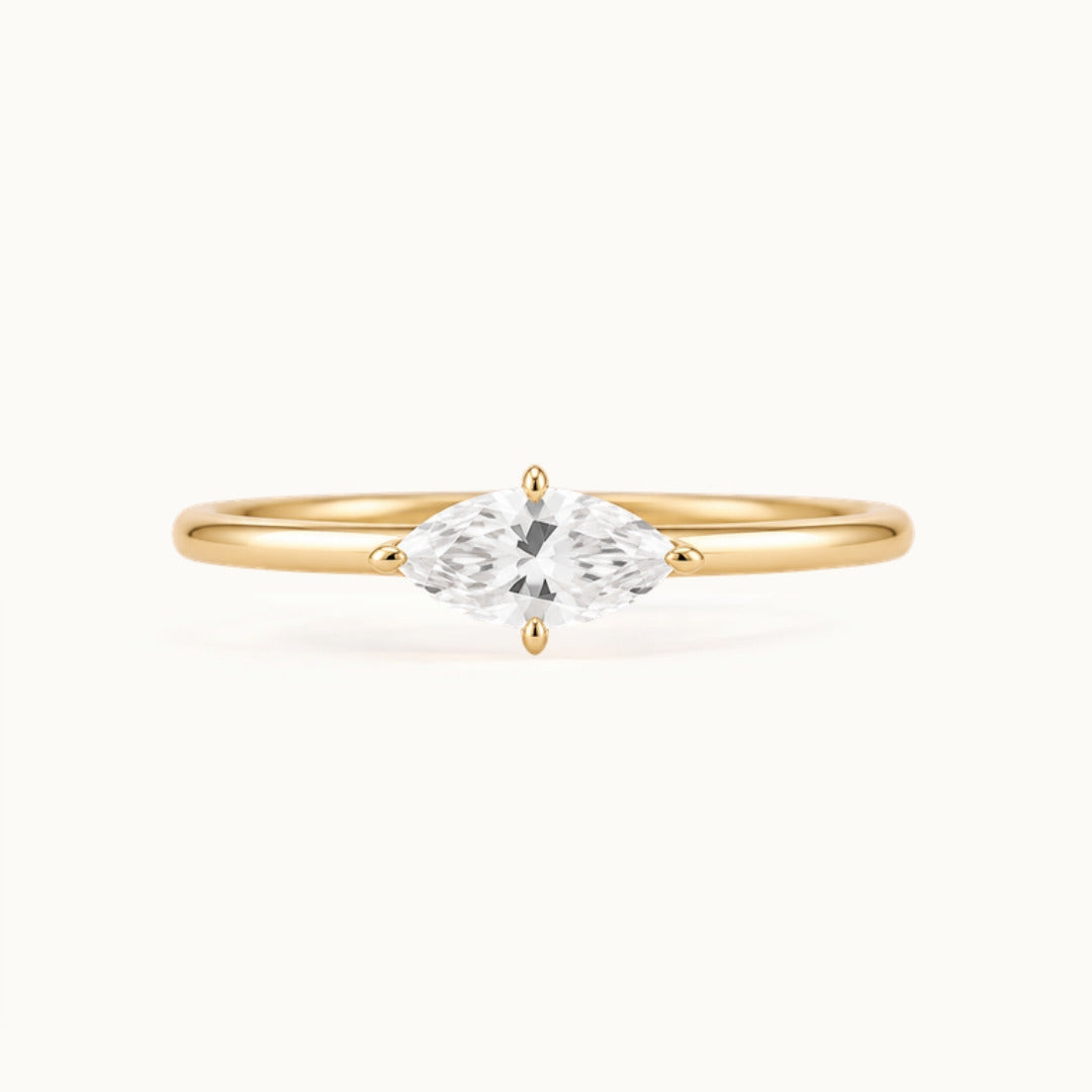 Margot Ring, an east-west marquise lab-grown diamond on a slim band, recycled 18K yellow gold