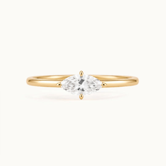 Margot Ring, an east-west marquise lab-grown diamond on a slim band, recycled 18K yellow gold