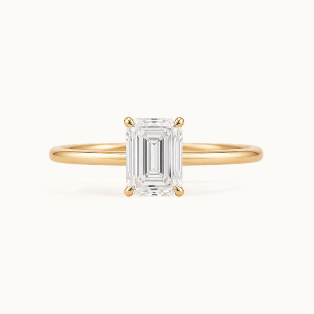 Primrose Emerald Ring, an emerald-cut lab-grown diamond solitaire in recycled 18K yellow gold
