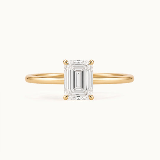 Primrose Emerald Ring, an emerald-cut lab-grown diamond solitaire in recycled 18K yellow gold