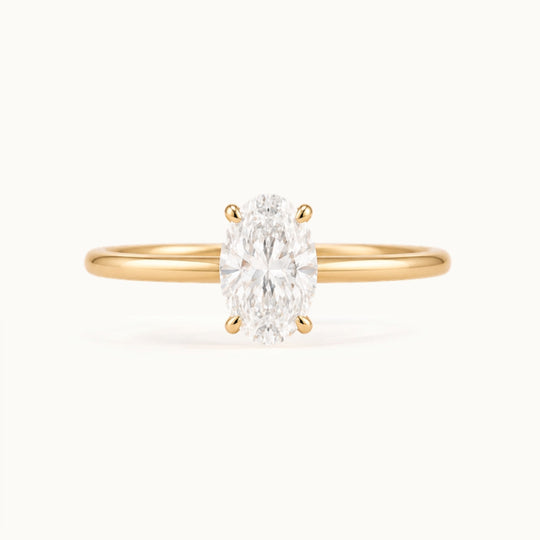 Primrose Oval Ring, an oval lab-grown diamond solitaire in recycled 18K yellow gold
