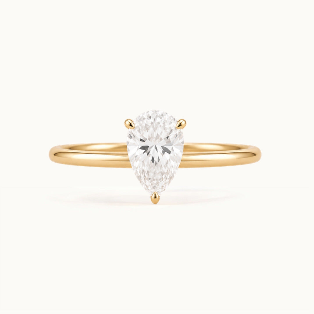 Primrose Pear Ring, a pear-shaped lab-grown diamond solitaire in recycled 18K yellow gold