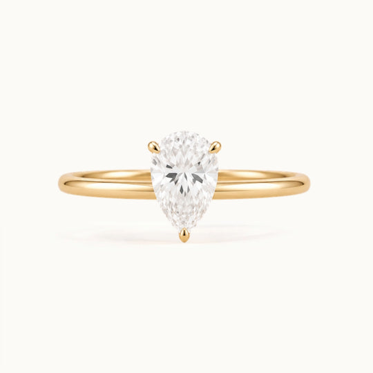 Primrose Pear Ring, a pear-shaped lab-grown diamond solitaire in recycled 18K yellow gold