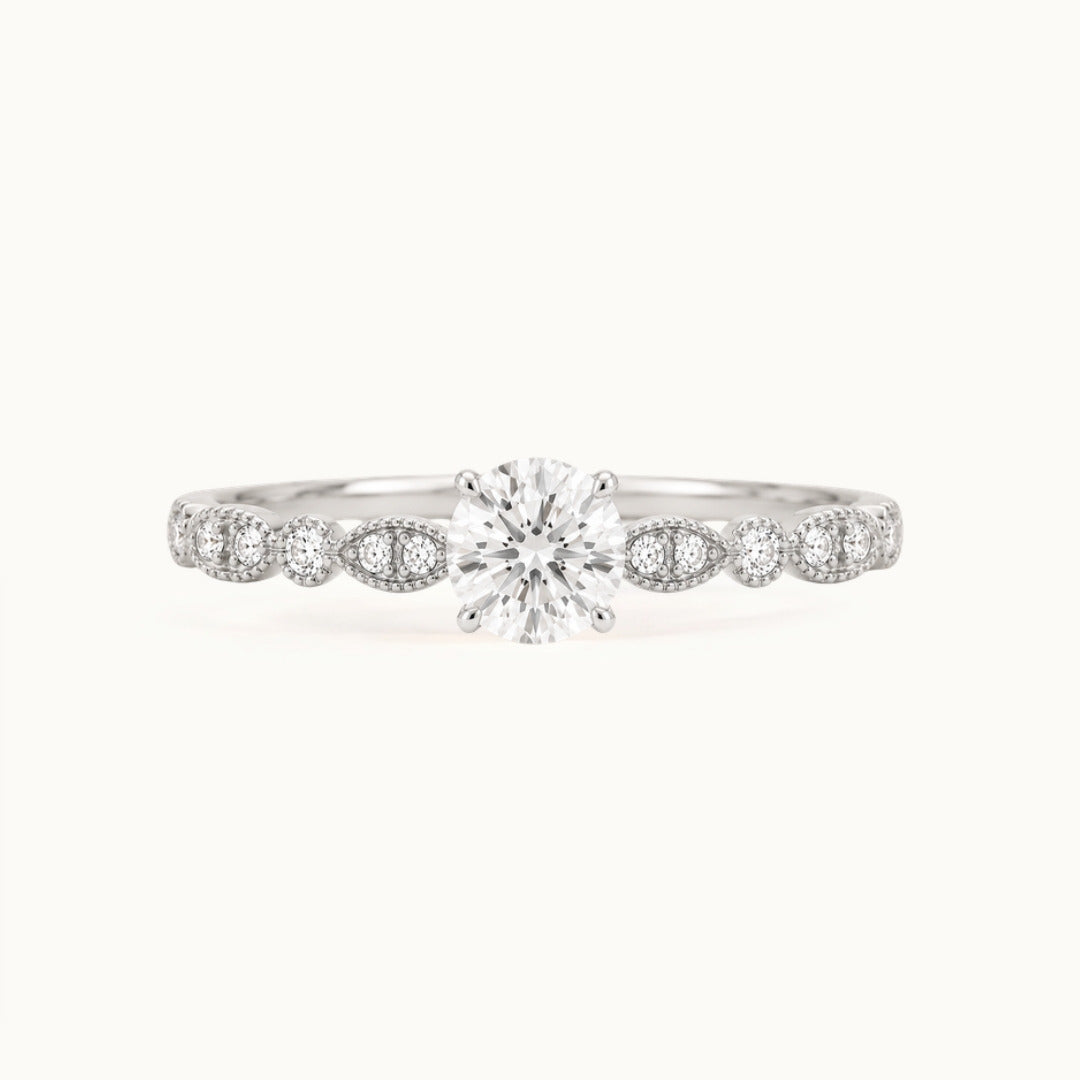 Viola Ring, a round lab-grown diamond on a milgrain diamond band, recycled 18K white gold