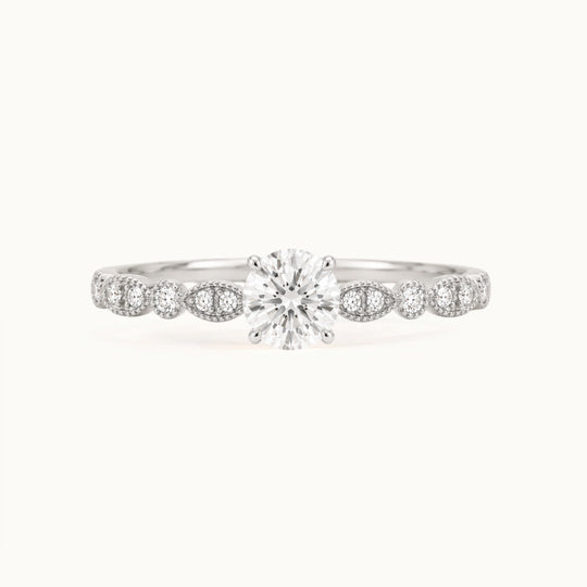 Viola Ring, a round lab-grown diamond on a milgrain diamond band, recycled 18K white gold