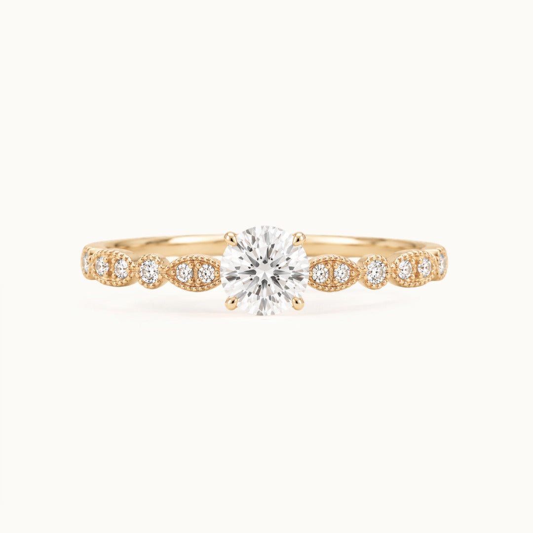 Viola Ring, a round lab-grown diamond on a milgrain diamond band, recycled 18K yellow gold