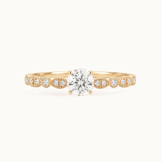 Viola Ring, a round lab-grown diamond on a milgrain diamond band, recycled 18K yellow gold