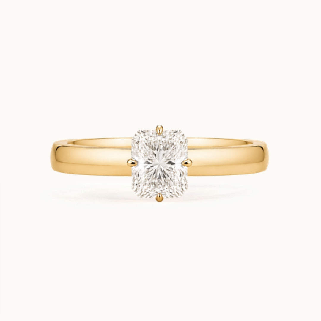 Vivienne Ring, a radiant-cut lab-grown diamond solitaire on a wide band, recycled 18K yellow gold