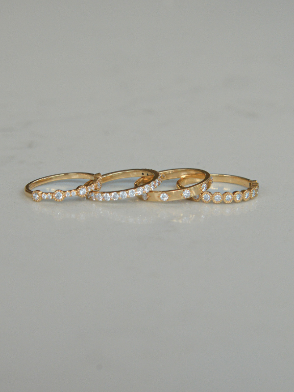 Set of four 18K gold labgrown diamond rings by Juna Fae, designed as stackable bands perfect for wedding rings or everyday rings to celebrate life’s special moments, all created in Antwerp with an ethical and sustainable production.