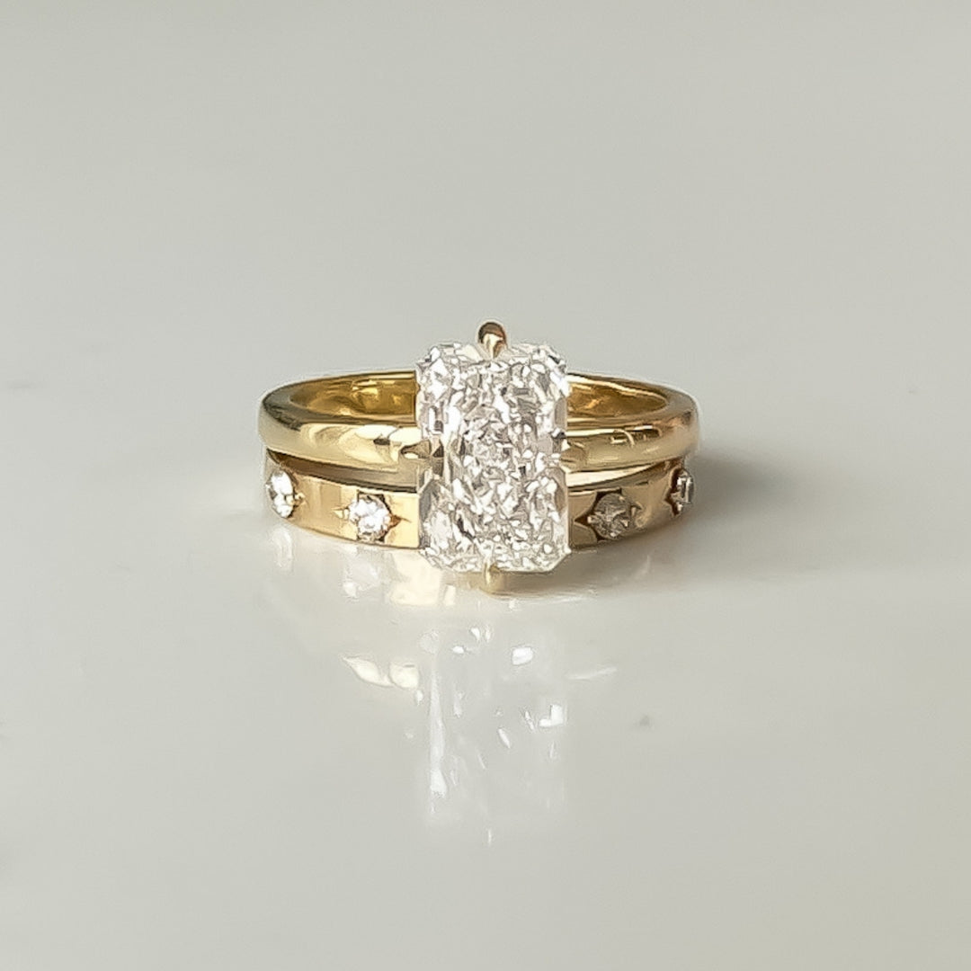 Radiant cut lab-grown diamond engagement ring in 18k recycled yellow gold by JUNA FAE, with star-set wedding band