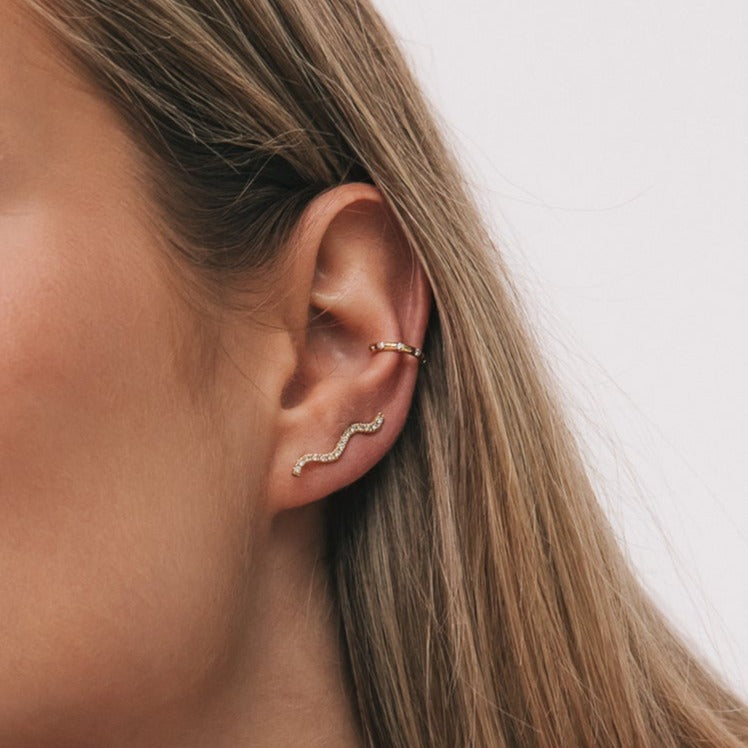 Model wearing the Cordelia Ear Climber in yellow gold
