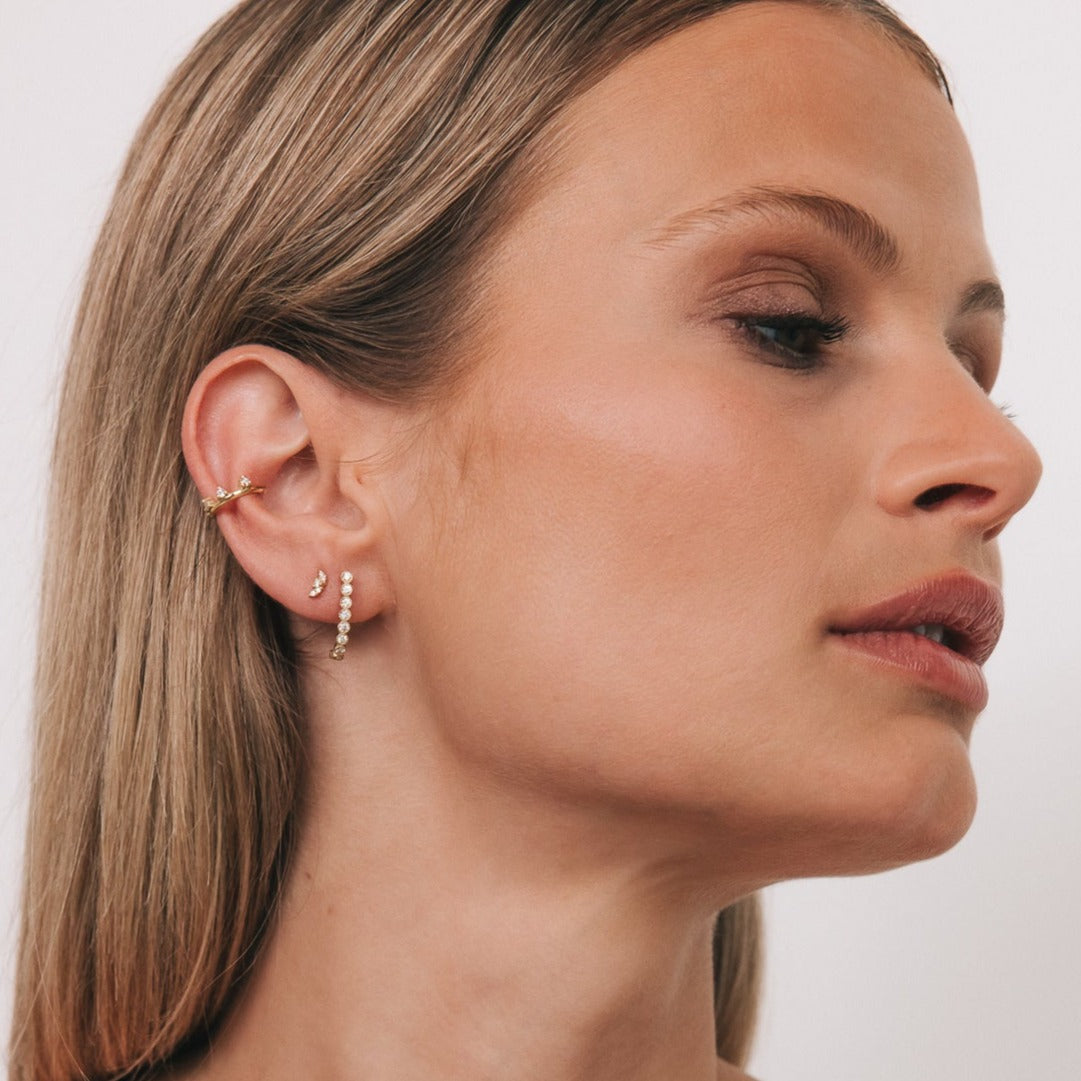 Model wearing the Senna Hoop in an ear stack